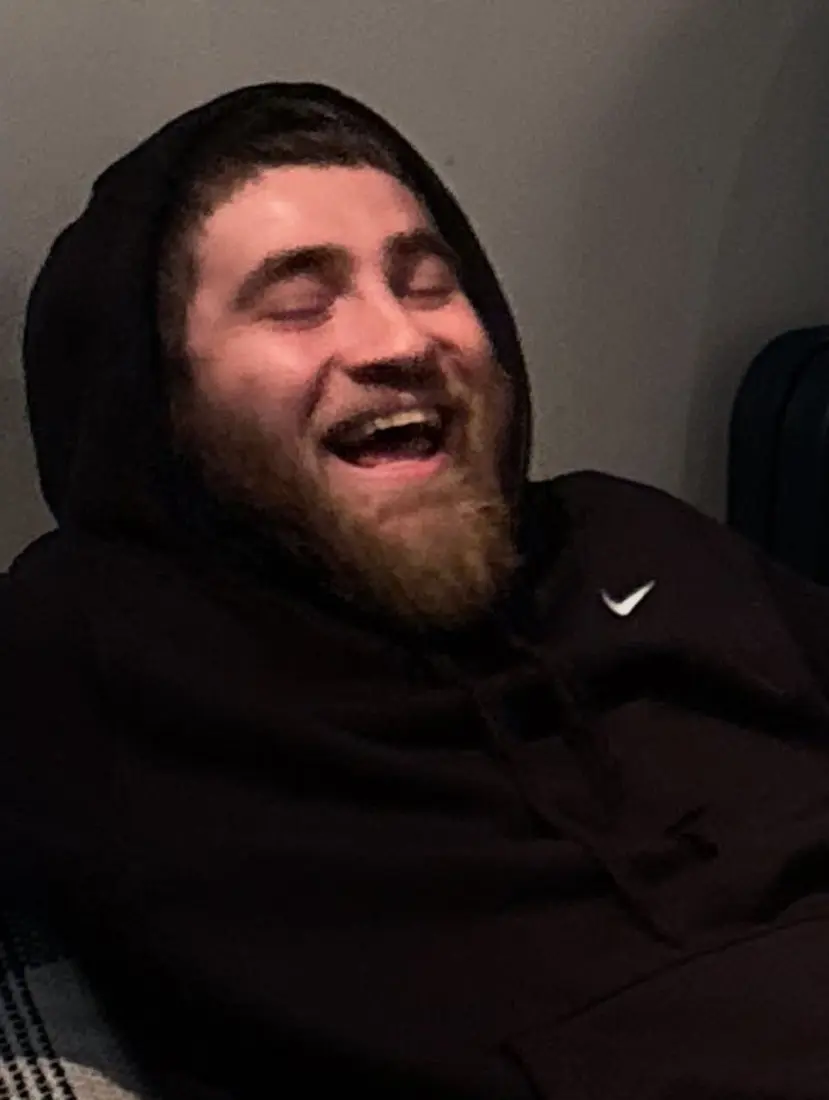 Michael Tennis Davis laughing, hood up